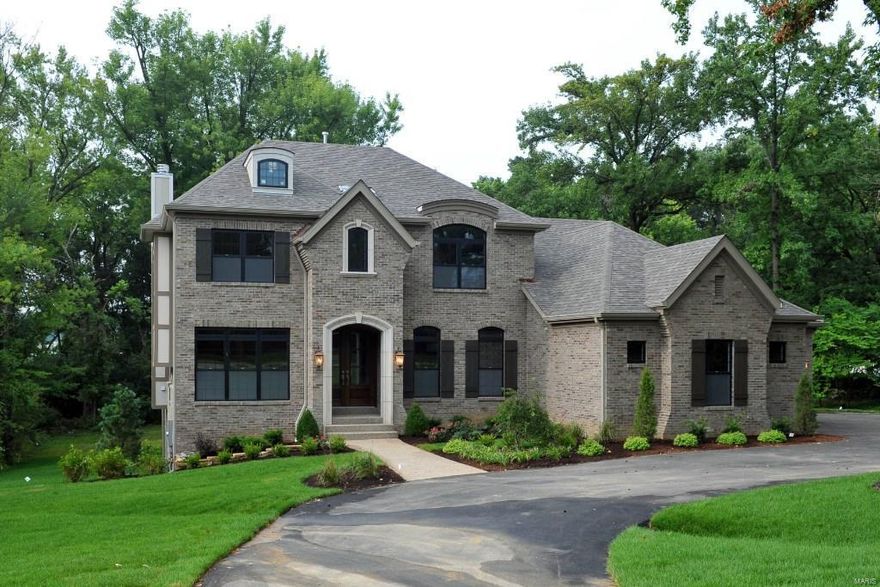 Impressive NEW home in the Village of Westwood with lovely design and upscale finishes, has great street presence with a gracious circular drive on a beautiful .844 acre lot. An open floor plan with 4,000 sq ft of space is perfect for todays living.  Main floor  entry opens to a living/study and dining room on each side and continues to a spectacular great room with 11 ft ceiling and black granite surround fireplace.  The hearth room with stone fireplace opens to the breakfast room and smashing creamy kitchen w/ stainless appliances.  Hardwood floors and an abundance of windows are throughout. A terrace overlooking the tree lined backyard is off the hearth room. Master suite is on the main floor w/ 3 additional bedrooms and 2 baths upstairs.  An oversized loft space completes the upstairs and is great for a playroom/media room or office. Amazing location next to medical centers, shopping, highways, restaurants and so much more!!