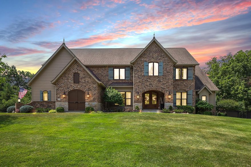 Custom 1.5-Story Flower Built home with 5 Beds, 5.5 Baths & 6000+ sqft of living space, is truly spectacular! Upgrades & custom amenities! Incredible architectural details throughout! Charming Foyer opens to Dining Room & large Family Room; 2-Story Great Room with beam ceiling, stone FP & built-ins. Gourmet Kitchen with granite, island, 6 burner dual fuel range with 2 ovens & Butler's pantry. Incredible 3 Seasons Room, overlooking private oasis backyard with pool! Main Floor Owners Suite with luxury Bath, dual vanities & dual walk in closets. Main Floor also has a 2nd Bed en suite. Upper Level finds 1 Bed en suite, while other 2 Beds share  large Jack/Jill Bath. Large Office/Den rounds out the Upper Level! Finished, walkout Lower Level with Rec Room, Game Room, wet bar & full Bath. Perfect for entertaining! Additional features include Main Floor Laundry, brick & stone exterior, French Country Style, 3 car side entry garage & more! Additional Rooms: Sun Room