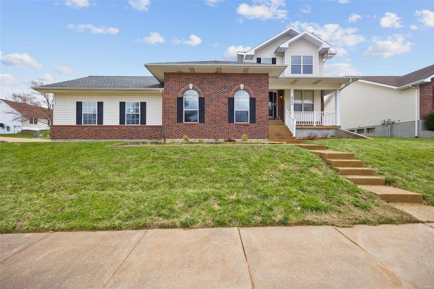 Welcome Home to this inviting home situated on a desirable corner lot, featuring a covered front porch perfect for relaxing. Inside, enjoy the warmth of a wood-burning fireplace in the spacious living room, and the durability of LVP flooring throughout the main living areas. A centrally located powder room is near the spacious eat-in kitchen that has sliding doors opening to the backyard patio,  while the formal dining area is bathed in natural light.  The Big Bonus of the Main Floor is a VERY large bonus room that could serve as a Game Room, or Family Room! It will not disappoint you! Upstairs, are 3 generous sized bedrooms, including a primary suite w/two closets & a private bath. and a hall bath. The finished lower level offers additional living space, featuring a recreational room & a half bath—ideal for a home office, or a playroom. Guess What...There is an Oversized Garage too. With neutral colors and updated fixtures, this home is move-in ready. Make this beautiful home yours!