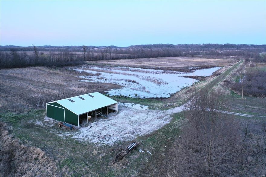 Rare Opportunity to own a waterfowl farm in the Mississippi flyway! This 100+/- acre parcel is set up and ready for you and your friends to shoot a limit! With a 20+/- acre levied field that has pumps, gates and a pit blind, as well as 2 other pools with water management and blinds, they'll be coming into the spread in no time. Property also offers 25+/- tillable acres for some farming income, a 25x50 pole barn on a berm to hold all of your decoys, layouts and SxS. Bob's Creek meanders through the land as well and a 2.25+/- acre river lot with direct access to the Mississippi is included with the sale, perfect for building an elevated cabin! This sportsman's paradise is only 40 minutes from Lambert Airport, making it the perfect place to hunt in the morning and still make it to work at a decent time. Several flocks of ducks can be kicked up off of this farm at any given time and current owners have had great success in the previous years of hunting it! Eastern 34 acres are in WRP.