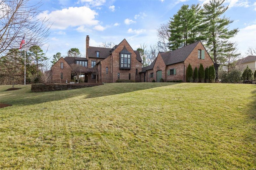 Designed by the celebrated architect and interior designer Bobby McAlpine, recognized as one of Architectural Digest’s 2018 AD 100 top architects, 42 Countryside Lane epitomizes McAlpine’s philosophy of luxury, serenity, and emotion, where mood is always present.  Reminiscent of an English Manor Estate home, 42 Countryside Lane is situated on 1.45 acres in the sought-after area of Frontenac. This exceptional residence has been transformed by the current owner with designer wallcoverings, fabrics, lighting and fixtures from Givenchy, Thibaut, Kravet, Brunschwig & Fils, Scalamandre, Oscar de la Renta, and more offering a feeling of sanctuary with three floors of spectacular living space. Additionally, the home includes a customized lower level, with every feature imaginable, a private guest cottage, a saltwater pool, spa, multifunctional sport court, and an extraordinary pool house on manicured grounds.