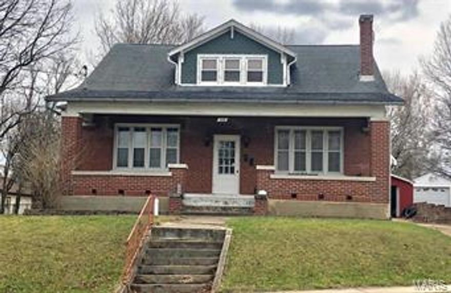 All brick, 2story, 6 bedroom home with heaps of character on a large, flat lot in town! This spacious home has room for everyone! The fantastic front porch beckons you to sit & relax. Original tongue/groove hardwood floors in most rooms. Tall ceilings & oversized windows throughout the main level allow plenty of light to come in & create an open feel. The formal dining room & large kitchen with eat-in space allow for casual or formal living. Three large bedrooms on the main level (one is currently used as a music/office room.) The upstairs has it's own exterior entrance, 3 more bedrooms, loft area & a recently updated bathroom & storage room. Full walkup basement w/storage spaces & workspace areas. The back yard is oversized, flat & mostly fenced making it a great play space for your family and pets. The detached 2 car garage also has workshop and storage areas. This is a large, solid home yet has room for sweat equity & improvements to your own taste. Make this great house your home!