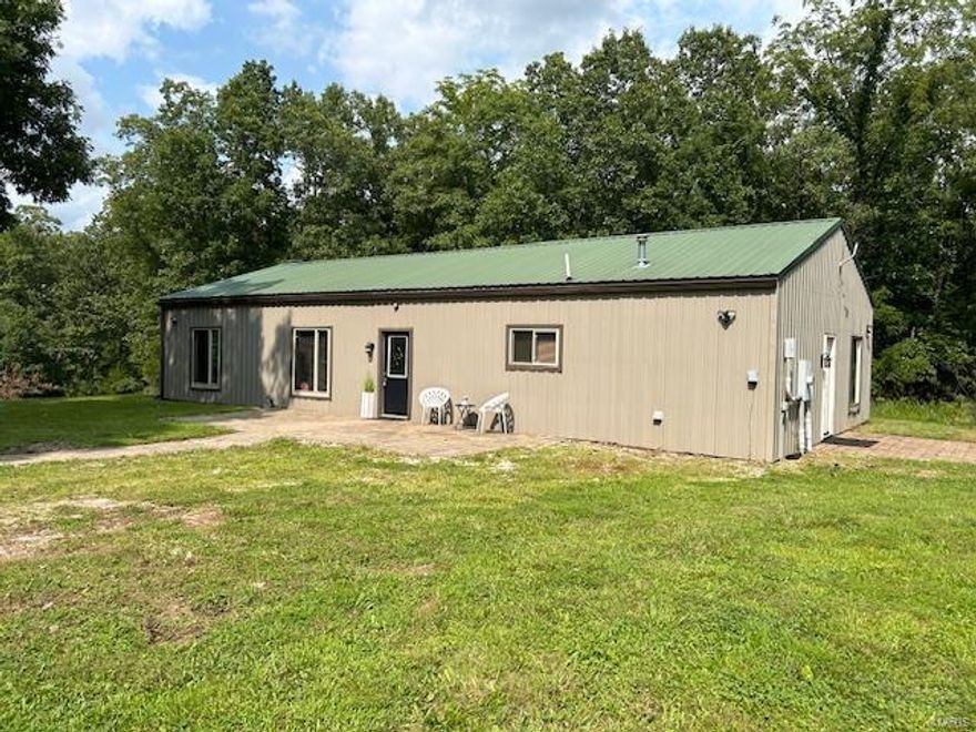 Discover your perfect retreat in the heart of the countryside nestled on 13 acres & conveniently located near I 70(15 minutes to Warrenton or 3 mi to Pinnacle Lake-a gated 130 acre lake community)  The 1800 sq ft home boasts exquisite oak cabinets, an open concept design, ideal for modern living & entertaining. Both oversized bdrms offer ample space & comfort. Indulge in the bathroom bliss of a tub big enough for a mini pool party or opt for a quick refreshing shower. Step ouside & immerse yourself in the peaceful woods for a hunting adventure or cast your line into one of the 3 ponds for a catch! Need  a home for your hunting gear, fishing tackle, & all your toys? Check out the 30x40 metal building & handy 10x12 storage shed-plenty of space to store your adventure essentials & vehicles too! Don't miss out on this opportunity to own the perfect blend of rural tranquility & recreational playground-schedule your viewing today! Buy 117 Skyline and enjoy Pinnacle lake amenities #24046784