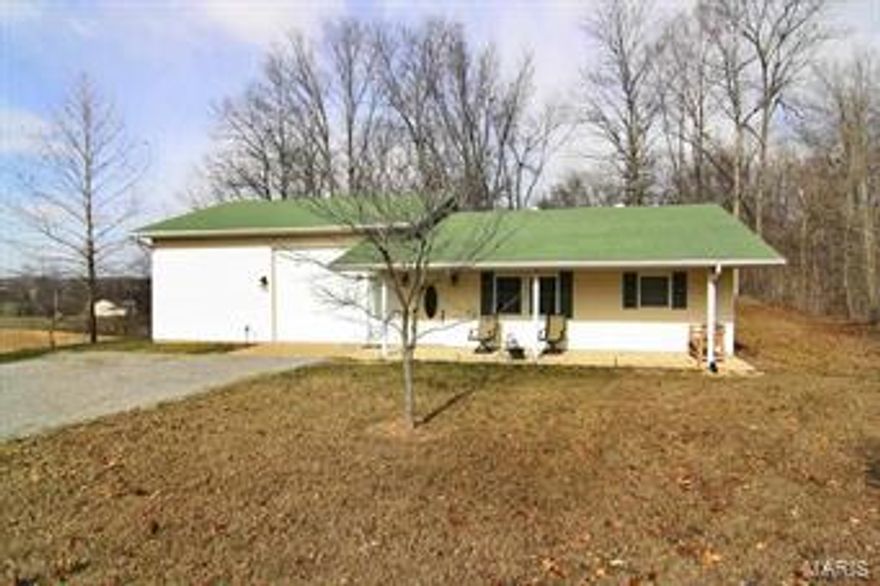 THE BEST OF ALL WORLDS ** How would you like all the benefits of a nice subdivision without all the rules?  This pristine home sitting on 6 acres (mostly level), has been completely renovated and the open floor plan provides the perfect setting for gatherings.  If your dream is a big garage / shop or if you have an RV, well this house is for you with a 30 x 30 garage tall enough to house an RV with 2 options of entry.  After tinkering in the shop you can relax in the peace and quiet of your deck and watch the wildlife play.  The entire living area has new hand scraped hardwood flooring and new ceramic tile in the bathroom.  Custom kitchen cabinet with stainless appliances and convenient laundry area completes the package. All this and NO COVENANTS OR RESTRICTIONS.   Close to P&G and easy access to everywhere else.