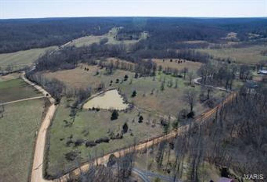 315 acres +/- FOR SALE, 8 miles North of Poplar Bluff, Butler County, Missouri  Located on County Road 523 (Tower Road) and Ritzy Lane, this multi-use property offers a variety of opportunities. New woven wire perimeter fencing on metal post surrounds roughly 150 acres of pasture with cross-fencing and new metal gates. Working pens and runs as well as 60x35 hay barn.  Over 1/4 mile of County Road frontage to the East. County road frontage to the West.  Stocked pond, fresh water flows through property.