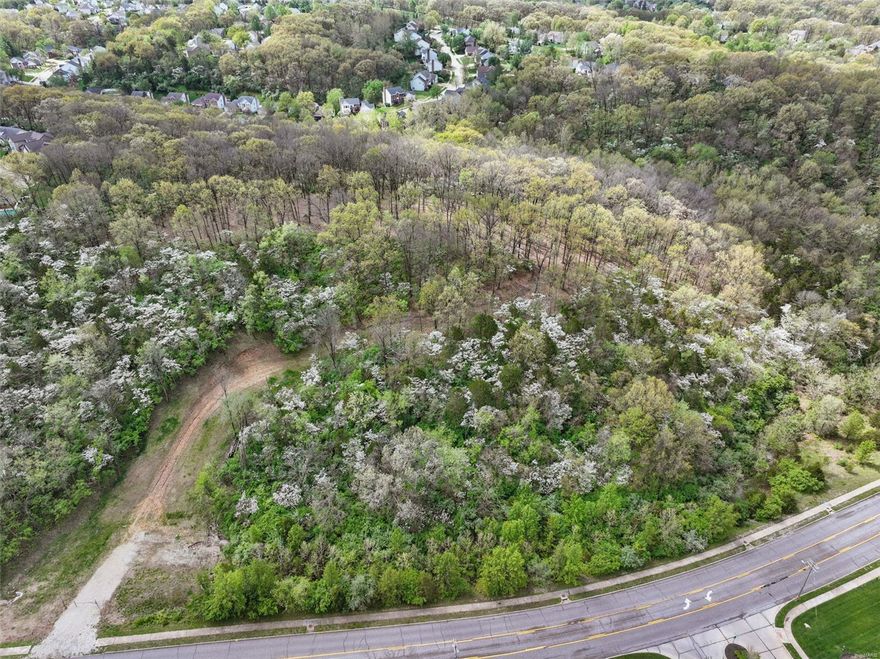 Back On Market - Wildwood did not approve proposed expansive non residential plans. An extraordinary opportunity awaits to create your dream estate on this breathtaking 18+ acre parcel. Perched atop a scenic hill, this property offers unmatched privacy, panoramic views, and a perfect canvas for your vision—all while being conveniently located.
A winding drive already cut into the landscape sets the stage for a grand entrance, leading to a partially cleared homesite primed for development. With previously approved plans from MODOT, MSD, St. Louis County and Wildwood, along with Geo-technical studies and Phase I Study, the path to construction is ready for execution.
Utilities are available, permits are ready to be obtained,  element are in place to bring your vision to life. Whether you dream of a modern sanctuary, a timeless manor, or a secluded private compound, this rare offering provides the foundation for something truly exceptional.
Secluded, stunning, and rich-your dream retreat begins here.
Watch the video to experience the beauty of this remarkable parcel