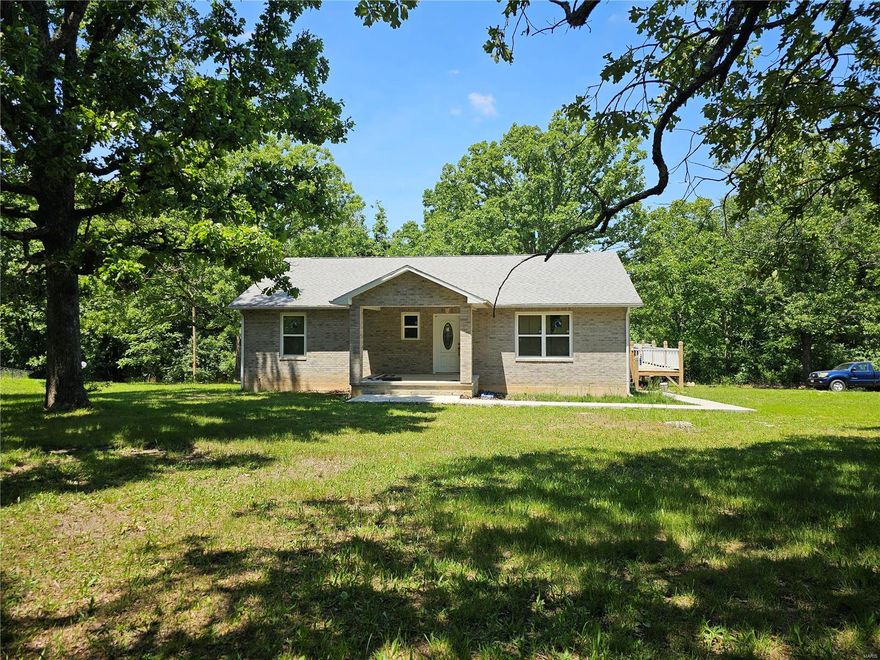 Check out this custom almost built 2 bedroom / 2 bath ranch beauty situated on just over 2 acres.  As you open the front door you will be in awe at the wooden walls and ceilings.  All new hardwood flooring completes the look.  Owner was in the process of finishing the home when he became ill and never came home.  Building materials are in the home to complete. On the outside, the wrap around deck will be a great retreat on those cool summer evenings and the convenient location to downtown, schools, and shopping makes it a great place for you to call home.  Call today to schedule your appointment.  It's a must see.