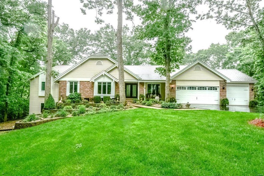 Nature Lover's Paradise! Atrium Ranch on 3 Wooded Acres on Peruque Creek with Full Lake St. Louis Amenities. Fabulous gourmet kitchen with top-of-the-line Jenn-Air appliances with oversize built-in refrigerator, built-in ovens and microwave, beverage cooler and wine cooler, tons of granite counters & huge center island breakfast bar with vegetable sink, pasta water over custom stove. This kitchen is sure to please every savvy buyer. New LVP flooring throughout main floor living area. Vaulted great room with atrium overlooks the private wooded lot & waterway to Lake St. Louis. The sprawling first floor has a large foyer, formal dining room with crown molding, great room with fireplace & beautiful craftsman shelves, a separate family room/sun room off kitchen & 4 Bedrooms on the main level. The 22x17 master boasts a sitting area with fireplace and door to one of the two new decks. The Finished W/O LL has a Theater Room, Rec Room, Full Bath & Bedroom 5, plus 2 storage areas & a workshop.