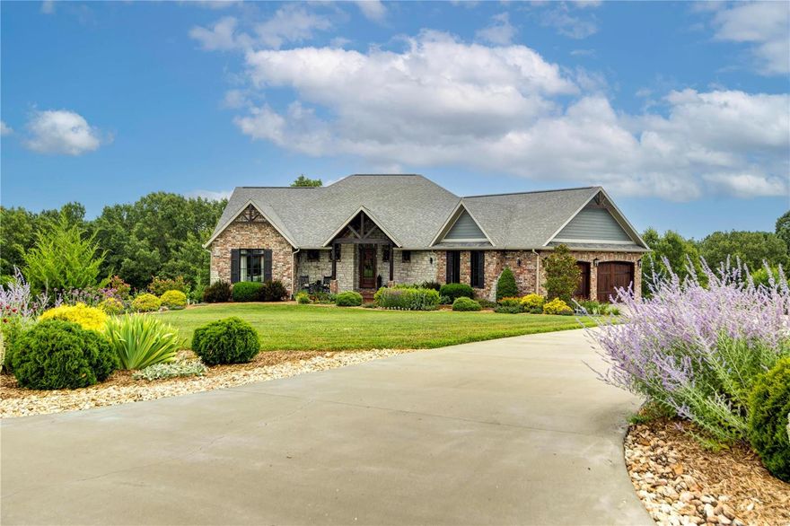 Located just minutes north of Table Rock Lake and 30 minutes south of Springfield, MO.

This 5,000+ sq. ft. modern craftsman home is situated on 5+ acres in a secluded, gated subdivision. Designed and constructed with quality, flow, energy efficiency and curb appeal as a must have. The home has 2X6 exterior walls, GEO thermal HVAC system, premium aluminum clad windows and open cell spray foam insulation. King size brick, stone and LP SmartSide makeup the exterior of the home.

The main level open floor plan has 2 bedrooms 2 baths, 9' vaulted and tray ceilings, custom beams and 8-foot doors. The Chef's kitchen is equipped with Wolf appliances which include double ovens, 4-ft range top and warming drawer. Custom hickory cabinetry throughout with granite countertops, prep sink, U-Line bar/wine fridge, walk-in pantry, built-in fridge/freezer and tons of natural lighting complete the perfect package.
