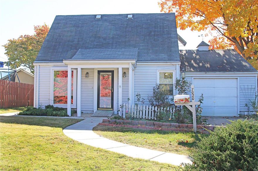 Wonderful home w convenient central location. Just a short walk from Metro link station and a famous S City deli. Cozy living room w vinyl windows. Newer eat in kitchen w 42" maple cabinets. Large family room with patio door and easy access to the private covered deck. One spacious upstairs bedroom w lots of built in closets. Main floor bath with amazing walk in jet/whirlpool tub. Large utility room w washer/dryer hookups. Partially fenced level back yard. Oversized garage w workshop area. This one just needs a little cosmetic, great bones.  Starter home, investment property or fix up and resale. Off street parking.  Don't be late, this one will not wait.