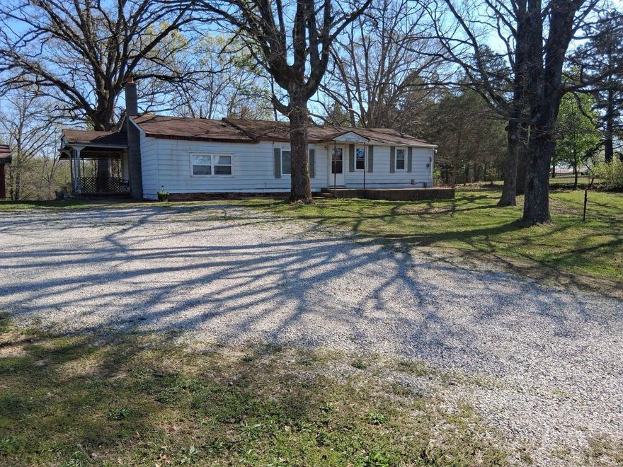 Location! Location!  Just 4 miles down M hwy on the right. Featuring 5.23 acres of wooded land with large yard and safe room/storm shelter. Property includes a large workshop for your hobbies or extra needed storage.