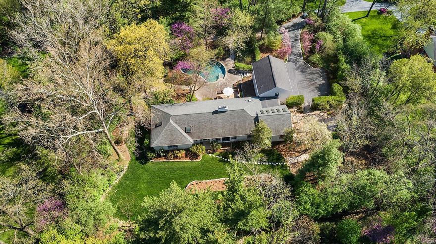 Paradise found. Perched in the middle of an idyllic 1.2-acre property, in the heart of Frontenac sits a light, bright and welcoming abode w/over 5000 TLA that boasts inspiring views from every room of mature trees & flowering perennial paths. Artfully transformed you’ll love all the new flooring, fresh color palette & attractive designer light fixtures throughout. Whip up your favorite meals in expanded chef's kitchen w/huge island, glass-front cabinets, pretty quartz counters, farmhouse sink, copper fixtures & hearth room w/see-thru fireplace. Enchanting gathering places flow from pergola entrance to vaulted/sky-lighted great room to tasteful DR & casually elegant LR. Admire 5 spacious bedrooms (2 private en-suites, one previously an art studio) & 5 stunningly renovated spa baths. Take advantage of the reconfigured walk-out LL (with rec room/bed/bath/office), gorgeous salt-water pool & plenty of outdoor getaway spaces for all your entertaining and relaxing needs. It's good to be home! Additional Rooms: Mud Room