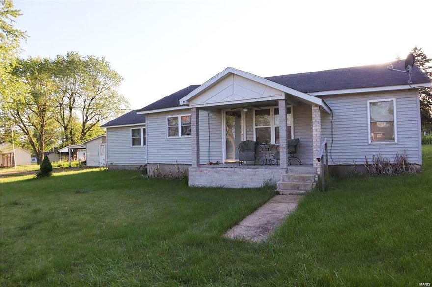 Great three bedroom home with horse-shoe driveway and detached work shop.   Home has a living room, family room, spacious kitchen and large walk-n-closet to accommodate two of the bedrooms.  The home sits on a large city lot with plenty of space to plant a garden and roam around on.