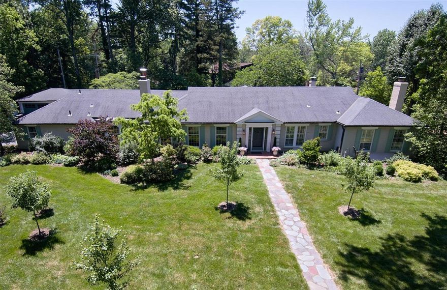 "One Warson Lane" says it all! Magnificently appointed, exquisite home resting on 1.3 acre lot, private drive in Ladue is truly remarkable. Entryway leads you to formal living & dining rm w/great flow, perfect for holiday gatherings & elegant entertaining. Gleaming hardwood floor, built-in bookcases, cherry wood paneling, moldings, 3 fireplaces, 2 wet bars, just a few of details. The high end, eat in kitchen will appeal to the most discerning chef with abundant custom cabinetry, Sub-Zero refrigerator, center island & a door leading out to the kitchen herb garden. Your courtyard paradise awaits w/double brick patios, inground pool & charming gazebo. The greenhouse assures fresh produce & blooms year-round. The primary suite is lovely w/French doors looking out to the pool & spacious walk-in closet. Another bedrm suite & 2 more bedrm to complete this wing. A separate office/private bedrm suite is unique w/its own entry. Partially finished LL has rec/rm,1/2 bath & ample carpeted storage.