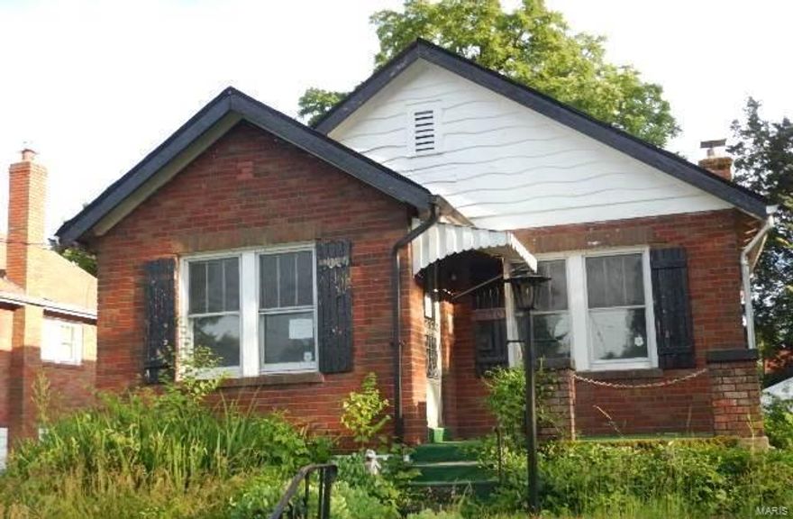 Brick bungalow with both formal living and dining room, 2 bedrooms and a detached garage.  This home has charm with it's arched doorways, ceiling fans, and original tile in the bath.  It's potential is shining through.  The basement is partially finished and adds another partial bath which is convenient.  Take a look because it's an opportunity you shouldn't pass up. SpecialListingConditions: Foreclosure