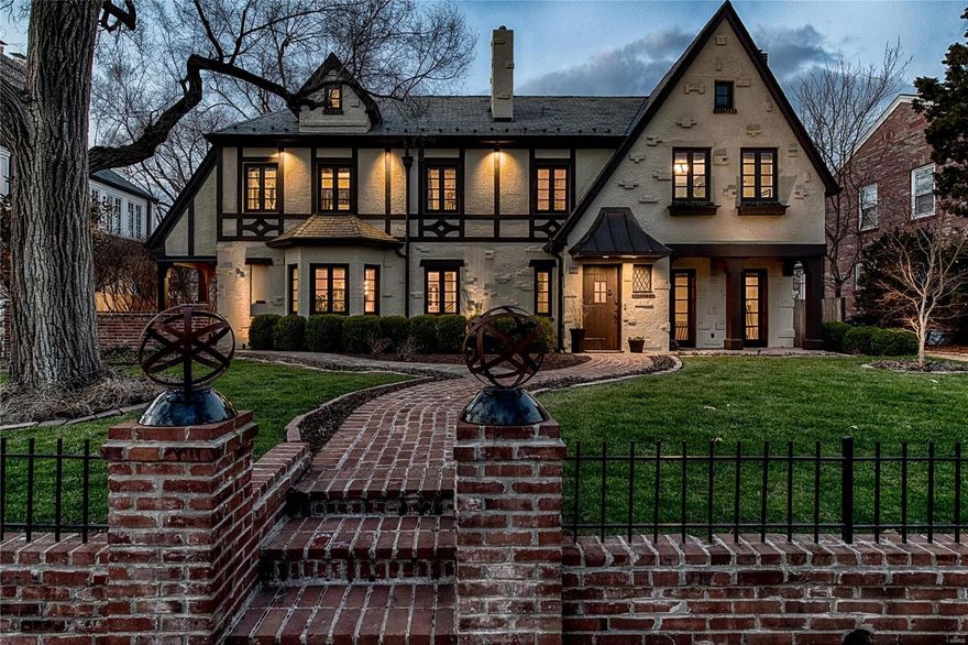 Masterful design and modern luxury in this Davis Place home beyond imagination. Custom down to the smallest detail, this immaculate former two-family invites comfort, and exudes positive energy. Enter into the formal living with built-ins and fireplace which flows into the chic dining room. All roads lead to the spacious, gourmet kitchen, a culinary workshop with custom cabinetry, high-end appliances, granite counters, and views of the awe-inspiring private, brick patio. Kitchen opens to the hearth with handsome fireplace and casual dining area. 2 powder rooms and office/bedroom space complete the main. Upper level boasts 4 generously-sized bedrooms and 3 full baths including a vaulted master suite with walls of built-ins and walk-in closet. LL features a charming au pair suite complete with kitchenette and full bath. The 3-car garage confirms this is a rare find. Minutes from Clayton and Shaw Park, short walk to schools, this home is the ultimate in sophisticated suburban living.