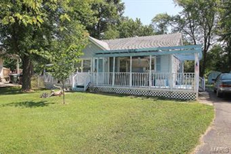 Fresh and ready to move in. Beautiful custom kitchen, lovely living room with hardwood floors, finished walk out lower level with generous family room and sleeping area. The HUGE level yard has lots of space to play, garden or anything you like. Outside are 2 storage buildings for plenty of outside storage. See this home fast before someone else makes it their home!
