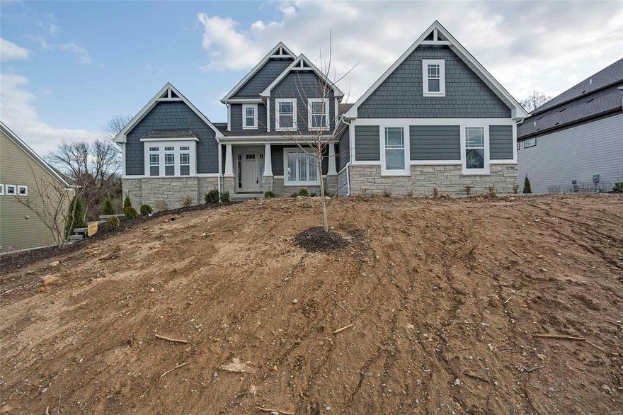 As you enter the home your eye goes to the 11’ great room window wall. Perfect for entertaining with the flow of the Kitchen, Breakfast Room and Hearth Room. Gas stone fireplace in the hearth room with built in bookshelves and ship lap surround.  A gourmet kitchen with 42” cabinets, crown molding, light rail, oversized island with overhang, double wall oven, gas cooktop, and microwave drawer. Striking Vaulted Ceiling in the luxurious Master Bath including free standing tub, gorgeous tile surround shower with heavy glass shower door, Separate Vanities and door to the commode. The separate Dining Room greets you just off the foyer. Step up Bonus room upstairs. A true Jack n Jill Bath with separate sink areas, plus Hall Bath. Sizable bedrooms with ample closets. Dual Heating and Cooling for maximum comfort. This home backs to trees.