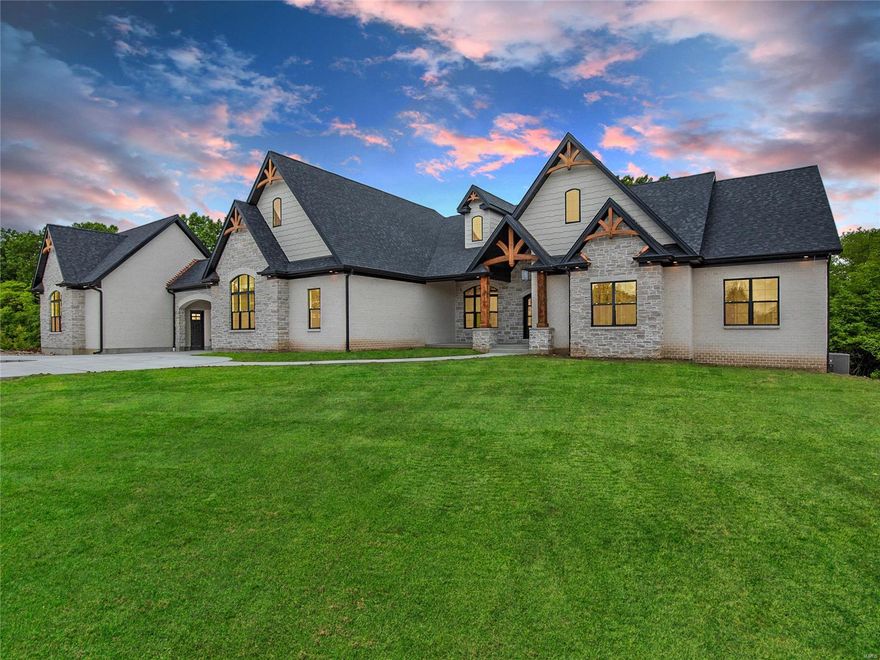 New Construction- Defiance, Francis Howell Schools! Main level with 9' and 11' ceilings with all 8' doors.  Lower level is unfinished with plumbing rough-ins including 1 Full and 1 Half bath, 1 Wetbar and 2 Bedrooms.  2-Car Attached garage with Porte Cochere to 3-Car Custom Detached Garage with half bath.  16x16 Covered Deck with Stone gas Fireplace, cedar pillars