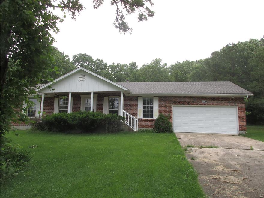 Check out this beautifully landscaped, partially bricked, all electric colonial style home with 3 beds 2 baths, right at the back gate of the Fort. The back yard actually borders the Fort. Asphalt all the way to your home in a well kept, quiet neighborhood. New Insulation, Some new flooring and a newer roof. The hardwood floors make it homey and the new See Thru Fireplace makes it feel comfortable and warm. The Master Bedroom has a walk in shower and double closets for him and her. The Kitchen, while not large, functions well with the dining room and fireplace. There is a large 2 car garage next to the kitchen so groceries are easy to unload. This would be a perfect home for anybody working or stationed at Fort Leonard Wood or an investor who would like a rental that would always be full.