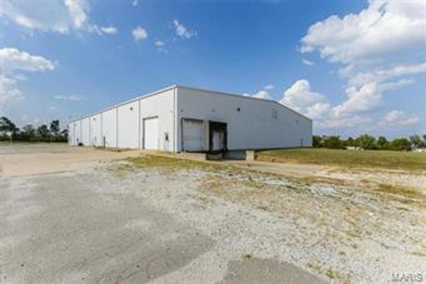 Huge Price decrease!  Motivated Owner.  Take a look and bring your offer!  This building is also available for Lease.  This is the building everyone is looking for.  30,000 sf Industrial building with 3,000 sf of office space on 4.55 acres.  If you need more room additional land is available.  Building has 16 elevated dock doors and two 14' drive through overhead doors and 3 phase electric.  If you are looking for a nice industrial building you need to take a look at this one.  Easy access to Hwy 64 and I-70.  Office area includes a 1,000 sf showroom, 400 sf conference room, 2 large restrooms, kitchen, office and reception area.  This property could qualify for the Lincoln County Enterprise Zone Tax abatement program.  Additional details available. Location: Industrial Area