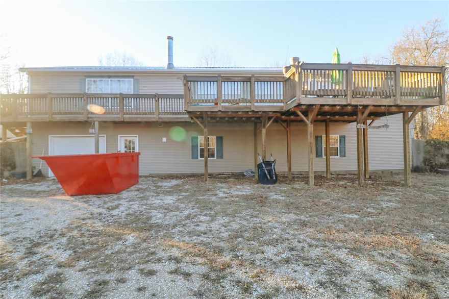 Come check out this spacious 3 bedroom, 2 bathroom home over an unfinished basement with plenty of room to grow! Walk into the open floor plan where you can relax in front of the wood burning fireplace. Go around the corner where you will see the large kitchen with the dining room right next to it perfect for family gatherings. Kitchen has plenty of counter space and stainless-steel appliances. Head to the master bedroom which has a huge walk-in closet and a large bathroom with double vanity sinks and a walk-in shower! Head downstairs where you will see a fully framed walk out basement which is plumbed and has the electric ran already! The basement also consists of a one car garage and a built in storm shelter. This home also has 30 acres with plenty of wildlife activity. It is a hunter's dream with deer rubs, a small pond, deer stands throughout, and a fresh water spring! This property won't last long so schedule your showings now. Additional Rooms: Mud Room