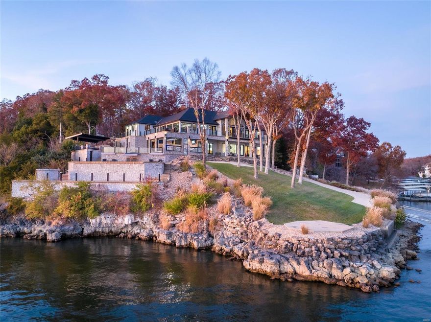 Point estates are very special, impossible to duplicate and rarely have moderate topography that doesn't require a steep drive or compromise access to the shoreline and your 5 slip dock! Welcoming and refreshing this home epitomizes lakefront living, offering a custom pool, hot tub, helipad, heated/cooled indoor bar with chef kitchen with roll up doors to bring the outdoor into your day. The views to the east and west are one of a kind and shown off from nearly every room in the house. Come enjoy the Midwest Coast on the beautiful Lake of the Ozarks, where we have a lifestyle for you. Additional Rooms: Sun Room