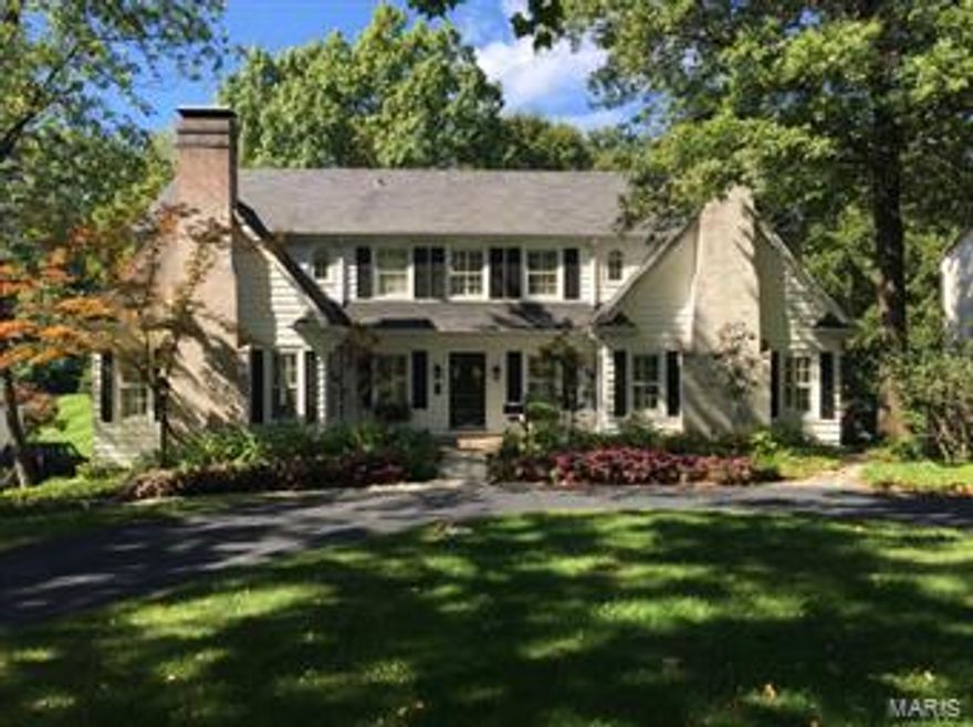 Classic architecture and floor plan with 4 bedrooms, 2.5 bathrooms, 10’ & 11’ ceilings on the main level, hardwood floors throughout most of the home. Recently renovated, including very large eat-in kitchen with stainless steel appliances and natural slate floor. Large family room with gas fireplace and 11ft ceiling, large dining room also with gas fireplace making this home perfect for entertaining, Plantation shutters throughout. Beautiful large landscaped backyard with multi-tiered deck. Electric, plumbing, heating and cooling have all been updated.  Full finished basement, heated three-car garage and circle drive. Reed/Ladue schools.