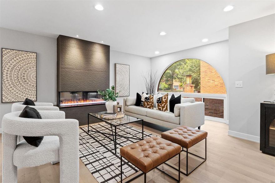 GREAT NEW PRICE! Indulge in the best of both worlds in this completely renovated contemporary condo in Old Town Clayton! Step into luxury as you enter the open-concept space, perfect for creating unforgettable moments. Enjoy cooking & entertaining in the gourmet kitchen w/custom cabinetry, leathered marble countertops & 8ft island. The stunning fireplace w/tile surround sets the scene for warm gatherings. This condo is adorned w/sophisticated details including iconic half-moon windows, curved entry wall & staircase w/hand-crafted iron railings. The primary suite offers a lavish bath w/floating vanity & oversized rain shower for two. Down the hall is an add'l bedroom w/ensuite bath. A powder room w/laundry closet completes this level. Downstairs find a spacious living area w/wet bar, sleeping quarters, full bath, den/office & storage w/2nd laundry. Amenities - 2 garage spaces, shared courtyard & pool. Nestled in a walkable community close to eateries, parks & top-rated Clayton schools! Location: Ground Level