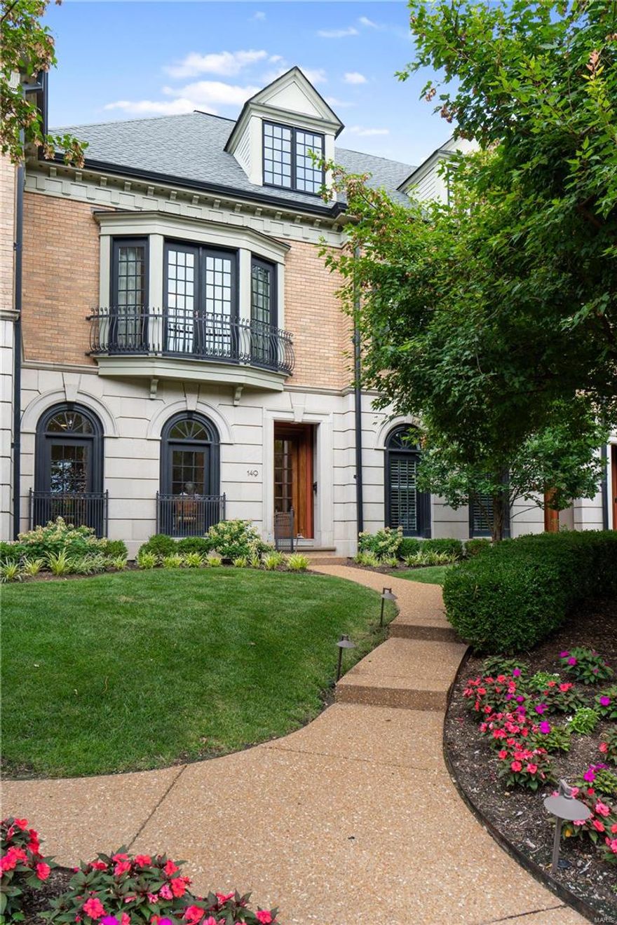 Down a quiet tree lined street in vibrant Clayton, this meticulous 3 bd, 2.5 bath townhome has an ELEVATOR that accesses ALL levels.  The rich Brazilian walnut flooring sets the tone for this chic unit showcasing 10 ft ceilings, formal living room and dining rooms, updated gourmet kitchen with custom cabinetry, SubZero, Wolf and Bosch appliances crowned with gorgeous quartzite countertops.  Walk out to a private patio oasis from the large light filled hearth/family rm with fireplace, built-ins and a wall of windows.  The primary suite with large custom closet and serene spa bath is the perfect retreat.  Find a laundry rm, 2 bedrooms and a hall bath also on the second floor.  Take the elevator or the steps to the third floor which is unfinished and full of possibilities.  3 assigned covered parking spaces.  Walk to shops, restaurants etc. Location: Other