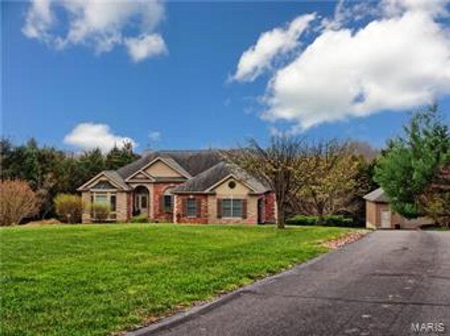 Introducing this beautiful 4 bedroom 3.5 bath home in the highly sought after Wilkinson Place subdivision! This ranch home sits at the end of a cul-de-sac on 5 beautifully landscaped acres. Large master suite features jacuzzi tub, separate shower and large walk in closet. Separated floor plan offers 2 additional spacious bedrooms with Jack and Jill bath. Large kitchen has custom cabinets, brand new granite counter tops and new cook top. Finished walkout basement offers beautiful bar, 4th bedroom, full bath, storage area and workshop accessible from the exterior. Covered deck offers quiet place to relax. Detached garage is insulated and offers 220 volt outlet and large work bench. Private back yard backs to woods with ATV trails. Lot is 70% wooded with a creek running the property line. Dual-zone heating and cooling and oversized water heater. Roof to be replaced this month!!!! This property and home is a MUST SEE! Easy access to hwy 44 and less than 10 minutes from Washington MO. Additional Rooms: Mud Room