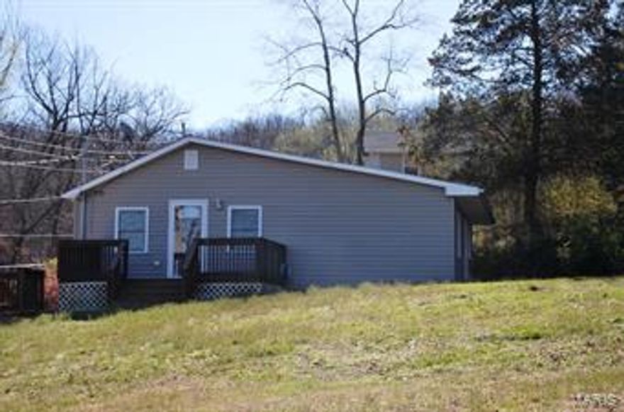 Don't Miss this one! Nice large living room, family room, eat in kitchen, two nice sized bedrooms and a very large utility room. Home has been remodeled by the owner....Waynesville School District...10 minutes from Fort Leonard Wood. Just outside of downtown Waynesville yet home has a secluded country feel.