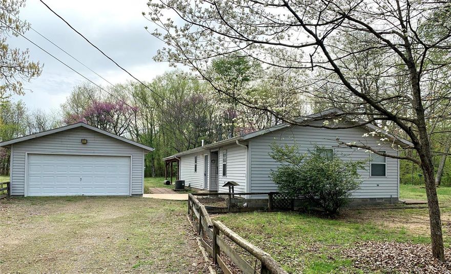 Now is your chance to own a place in the country and minutes to Clearwater Lake in Piedmont.  Room to store your boat, camper, or side-by-side!
Well maintained property on quiet street close to parks, rivers, and 1.5 miles from Clearwater Lake in Piedmont, MO - About one hour SW of Farmington MO.  Perfect starter, retirement, or vacation home!  Two large bedrooms, 2 full baths, laundry room, sun-room, nice kitchen and large open living space.  1.62 acres with 24x24 pavilion for entertaining.  Lots of shade trees.  Detached 2 car garage, and two sheds with electric in each.  Propane tank is owned.

All room measurements are approximate. Additional Rooms: Sun Room