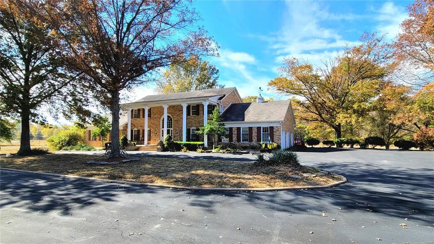 Welcome to Once Upon A Time Ranch! Inside the gated entry is an idyllic setting for this stately 2-story brick colonial. Peaceful lake has bridge leading to island w/gazebo. Beautiful 65+/- acres comes with plenty of vinyl-fenced pasture, round pen & more.  Barn w/hay loft has water, 220 electric & overhead door for parking. Outside, the home features two rear decks flanking the huge sun room/family room with its walls of beautiful windows & skylights overlooking in-ground pool surrounded by wrought iron fencing. Step into the dramatic two-story entry foyer & it will take your breath away. Two winding staircases flank the entry, one leading to the upper level where 4 bedrooms, 2 full baths & cozy sitting area are housed. The other leads to the finished, lower walkout level. Main level offers living room, office, formal dining room, master suite & more. Too much to include here, so Come, See for Yourself!