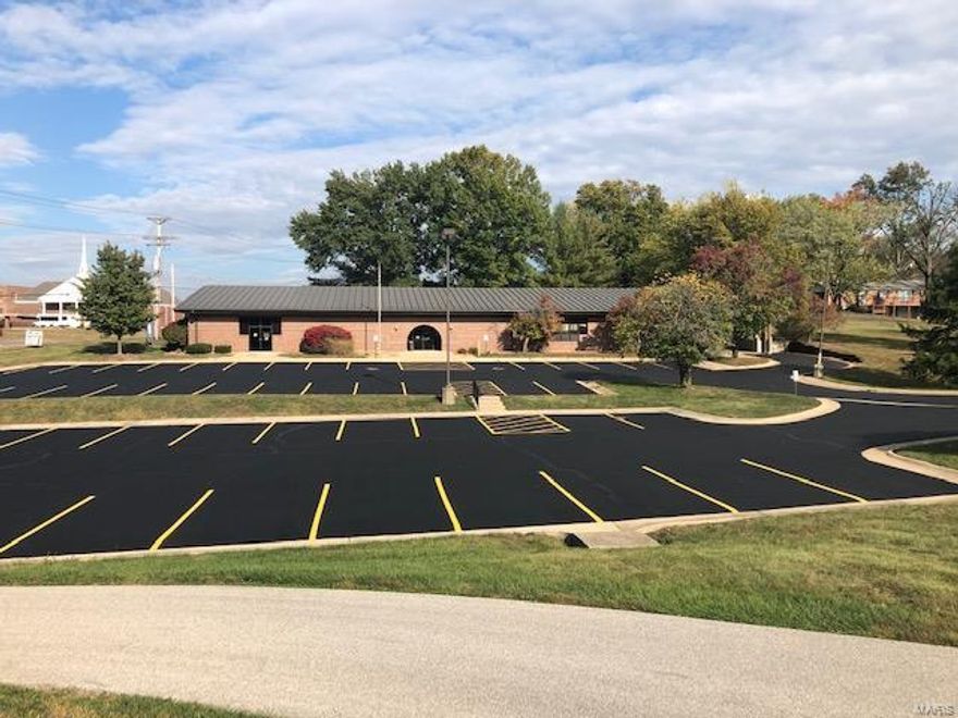 *** SUPER GREAT BUSINESS LOCATION & OPPORTUNITY! US HIGHWAY 50 FRONTAGE! ZONED B-2 HIGHWAY BUSINESS DISTRICT! 
 10,662 sq.ft. brick commercial building with additional 780 sq.ft. of covered loading area. Lighted & paved parking spaces. Must see inside to really ascertain the many ways this space can be used. Close to intersection of Highway 50/47N, only 4 miles to I-44. *** PREVIOUSLY WAS HOME TO SCENIC LIBRARY. ***MANY POSSIBILITIES HERE- START YOUR BUSINESS PLAN NOW! Call today!!  ** INCLUDES BOTH MAIN LEVEL & LOWER LEVEL LIGHTED PARKING LOTS WHICH TOTAL 55 SPACES! New Survey - 1.47 acres! Location: City