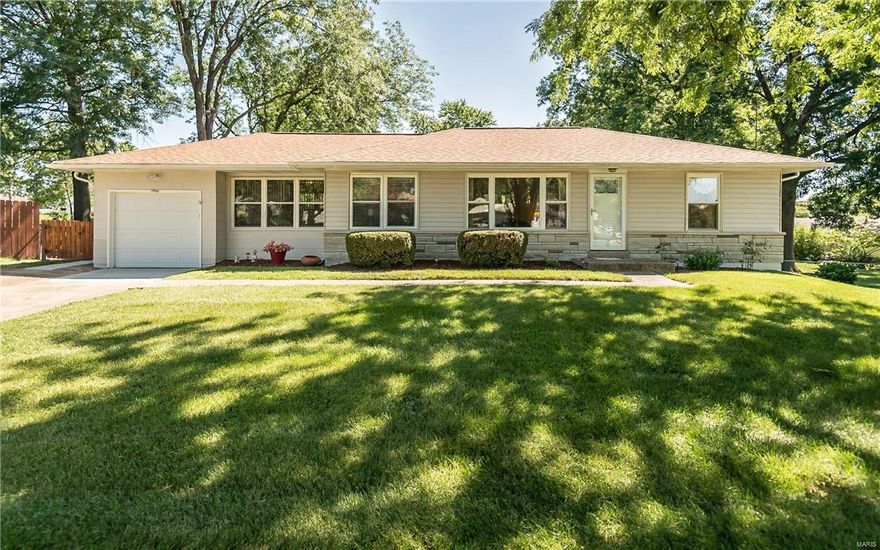 Check out this curb appeal and backyard.... Gorgeous well maintained 3 bedroom home situated on over 1/3 of an acre.  You will not want to miss all this home has to offer.  Some of the updates completed by this owner were new windows and blinds, new architectural roof and partial siding, new garage door and front door, ceiling fans and updated lighting. Bonus finished breezeway offers a great hang out space with tons of natural lighting.  In 2017 new sidewalks and patio were installed along with painting the finished lower level a nice neutral color.  This home offers a spacious kitchen with white cabinets, gleaming hardwood floors, and tons of natural lighting. You will absolutely fall in love with the outside space of this home. Come sit on the new patio and enjoy your large park like yard.  Seller is offering a 1 year home warranty.  Easy access to shopping, schools and highways. This one is a MUST See!!!