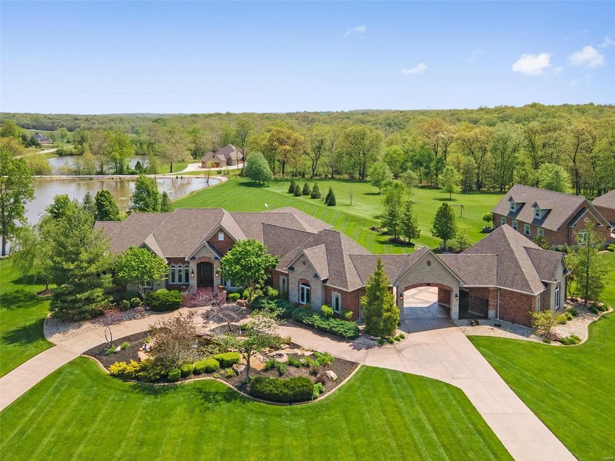 Sprawling ranch on nearly 4 acres filled w/luxury finishes! Saltwater pool w/diving board & full bath overlooks the stocked lake, w/covered patio offering stunning wooded views. Attached rear-entry 3-car garage + detached oversized 2-car garage. Soaring 12' ceilings w/crown molding & hand-scraped hickory hardwood floors on the main level. 3 gas fireplaces & custom built-ins. Chef's kitchen w/huge breakfast bar, 42” custom cabinets, center island w/prep sink, walk-in pantry, butler’s pantry, & SS high-end appliances, including built-in fridge, beverage cooler, double ovens, & gas range w/grill & griddle. Sensational tongue & grove wood ceiling. Luxurious primary suite w/trey ceiling, walk-in closets w/organizers, & spa-like bath w/multi-head tile & glass block  ThermaSol steam shower. Finished walk-out LL includes a rec room w/unbelievable custom wet bar. Powered by top quality systems. Wentzville Schools (BRAND NEW middle & North Point High). Exclusive neighborhood! See it today! Additional Rooms: Mud Room