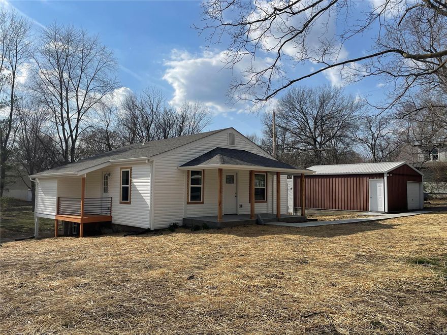 Charming, Renovated from HEAD to TOE and Ready to Go  !!!  2 bedroom, 2 bath cottage that has it all.  You have the charm of an older home just off Main Street, Troy MO with the updates you would expect in a custom new construction of twice the size.  Master bedroom is sized good and has a spa feeling bathroom.  Second Bedroom is sized well too.   2nd bathroom was not left unnoticed.  Great finish.  Kitchen has brand new black appliances, cabinets, upgraded hardware and granite top.  New roof, New siding, New Windows, New electrical, New plumbing, New HVAC, New Flooring, New Paint, New cabinets and more !!!  18 x 26 garage, 18 x 26 carport and 12 x 20 hobby shed on double nearly 1/2 acre lot.  Call Today as this one is priced well and ready to go !!!