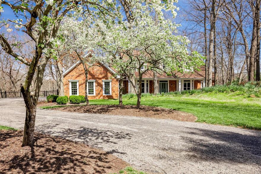 Impressive DeShelter ranch sits on 1.8 acres on a quiet cul-de-sac w/ 4 bedrooms, 3.5 bath & 3 car garage. This home is decked to the nines w/ features throughout including stunning millwork, elevator, generator (2015), 6 ft case openings (totally handicap accessible), 9 ft ceilings, security system w/ exterior cameras, wood flooring & Hardy Plank siding. Lovely entryway w/ 11 ft ceilings leads to paneled office w/ built in bkcases & DR w/ bay window. Large great room w/ vaulted ceilings & beams, gas FP, wet bar & gorgeous view to bkyd. Gourmet kitchen w/ granite counters, island, SubZero fridge, Thermador induction stove, double oven, walk-in pantry & FP & charming hearth room w/ door leading to Trex deck (2013). Main flr consists of laundry, private main flr primary suite w/ full bath, coffered ceilings, huge walk-in closet & private deck, 2 add’l beds & full bath. Finished LL features 9ft ceilings, family rm w/ FP, bar, 4th bed, full bath, sitting rm & walk out that backs to woods.