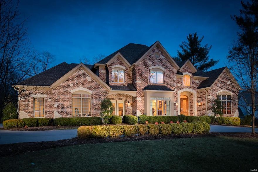 Custom to Perfection! Sweeping 2 story entry foyer w/ circular stairs opens to paneled study/library. Exquisite millwork, sleek finishes, spacious coffered dining room, 2 story light filled great room w/ fireplace balcony and wet bar adjoins chefs kitchen/ breakfast room / hearth room with stone fireplace and butlers pantry .Large utility/laundry with great storage,private office with custom blt.ins and oversized 4 car garage. Luxurious Master Retreat with new hardwood floor on main with fabulous bath(has all the bells and whistles) Plus 4 spacious  bedrooms on second & 3 full baths. Resplendent spaces include beautifully designed walk out lower level w/ theatre room, separate gaming and granite topped homework stations, mirrored exercise room, updated full bath and ample amount of storage space. Step outside to the gorgeous  (less than 2 years) patio & sparkling pool w/ fabulous privacy.  Recently painted throughout w/ fresh neutral décor.  State-of--the-art media & alarm system.