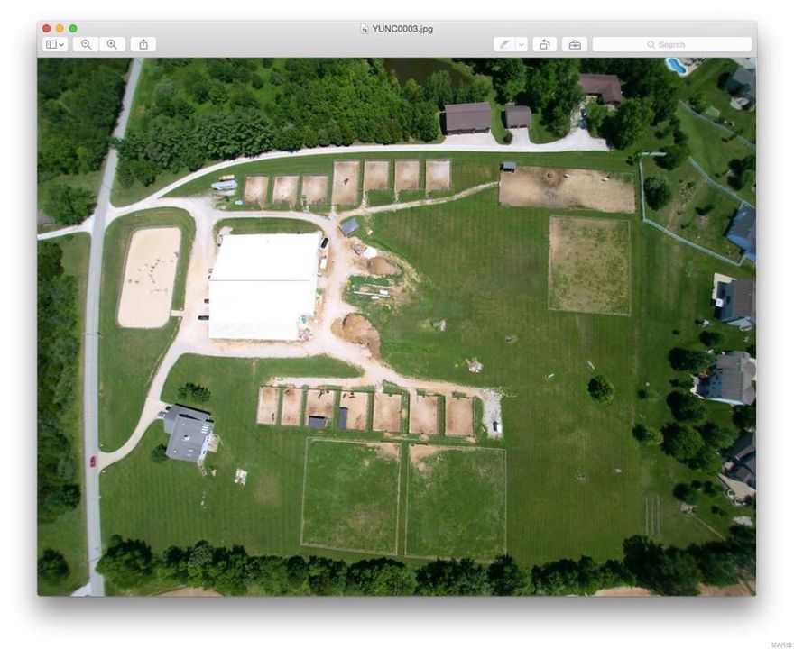 Great opportunity to own a turn-key horse operation. Est over 26 years ago & withstanding the ups and downs of the market trends. Perfectly situated, in the heart of the St. Charles Equestrian community—3 miles to two major hwys, 2 miles from the National Equestrian Center makes filling your lesson program a breeze. Sale includes 4 large pastures for grass turn-out, 12 all weather paddocks with cross-fencing and electric fencing, cross-country jump fields, and 4 bed house. 20,000 sq feet of building encompasses 40 stalls all with automatic and freeze-proof waterers, 2 hot/cold wash racks, 2 bathroom & laundry facilities, storage for hay, viewing room, 2 feed rooms. Indoor arena is 140 ’x 80’ and attached to barn aisle-way keeping boarders happy that even in winter they can always ride and turn out horses. This all-weather facility built to withstand the extreme cold and high winds. Outdoor arena is 172’x90’ fenced and crowned for quick drainage & nearly year round use. See drone video
