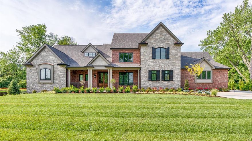 The home of your dreams! 5,800 SF New construction by Mark S Homes. 1.5 story brick & stone residence sits on nearly 1 acre in the heart of Frontenac. 5 BR/5.5BA,  Spacious open plan perfect for family & entertaining; outdoor rm with fridge & grill; Mahogany front door w/wide foyer leads to vast heart-of-the-home lr-kit-fam rooms w/great sidelines.  Fine details abound: tray & vaulted ceilings, dark hardwoods, arched entries, Pella windows, 2 Frplc,custom finishes & beautiful lighting.  Gourmet kit opens to a dramatic hearth rm w/ full stone Frplc. Center Island kit w/breakfast bar plus a separate breakfast rm, Custom cabinets, stylish range hood, beautiful backsplash, Wolff/sub-zero appl. The 1st floor study is adjacent to lovely master en suite. 2nd FL overlooks living area, 3-ensuite BRs.  LL: huge fam rm/wet bar & fridge, 5th BR & BA plus over 1500SF of unfinished space; 3-car gar, dbl-wide drive provides ample parking. Fully landscaped yard w irrigation system & outdoor lighting. Additional Rooms: Mud Room