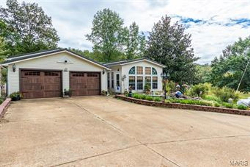 If your looking for freedom, peace & quiet with a beautiful view, make an appointment to see this farm! You can hunt, ride horses or raise livestock & cattle. There's even a couple ponds for wildlife or farm animals. With 2 homes that are NEAT, CLEAN & meticulously upkept & decorated, all the comforts are included! The old red barn will store hay for the winter & make cover for the animals. The double car garage is heated & perfect for working or protecting a couple vehicles. The 1st home has 3 beds, 2 full baths, a beautiful sunroom, as well as a living room with a fireplace & a family/great room with a wood burning stove & a kitchen with breakfast room & a formal dining room as well as a big wrap around porch to enjoy the view! The other single wide mobile home has 2 bedrooms and 1 nice, full bathroom & another big porch! The sellers enjoy the country life & gazing at wildlife from the windows and deck. If you have been looking for serenity, this could be just the right home for you!