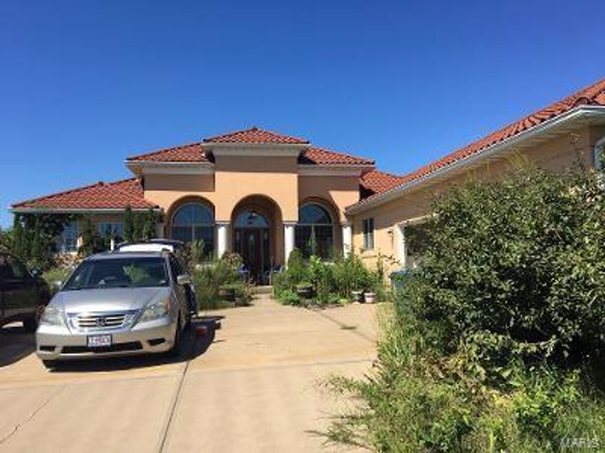 Custom Built Home on 15 Acres in Hillsboro. Very spacious home with main floor laundry. Attached 3 car garage. Metal building suitable for horses (stable). Fenced and there is a small pond. Geothermal & solar panels! This property is very suitable for subdividing & creating 14 custom homesites! Call for private viewing (appointments only).