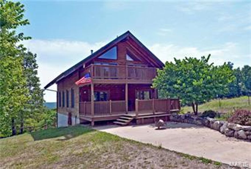 LOCKED GATE..NO DRIVEBYS!  Picturesque setting w/ backdrop of panoramic cross valley views is home to this 1.5 story log house on 74 acres!  Features include 3 bedrooms, 1 bathroom & over 2200 sq. feet of comfortable living space.  Special amenities include posts & beams, wood & tile flooring, Anderson windows & doors, wood walls & ceilings, skylights,  a 40X50 pole barn w/ a 10 ft. lean-to, and fenced pasture. Enjoy the outdoors on either of the 2 decks, the fire pit, or on of the numerous trails carved throughout the property.  The kitchen has a breakfast bar, tile flooring, glazed maple cabinets, silestone counters & white appliances.  A magnificent 31X26 2 story great room w/ wood-burning stove & wall of windows, a bedroom w/ private access to the deck, & hall bath round out the main level.  The upper level features 2 additional bedrooms w/ walk-outs to the upper level deck, & the lower level includes a large family room w/ 2 walk-outs & plenty of space for both media & game rooms.