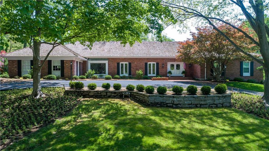 Traditional Ladue estate on 3 acres boasts many recent renovations & a fabulous floorplan! This spacious two story home provides all the living area a family needs in an excellent, accessible and gated location! Two story entry leads to gracious formal Living Rm & Dining Rm beyond. Updated kitchen features high end stainless appliances, center island & overlooks the private, wooded yard w/private hiking path. Large Family Room is great for relaxing or entertaining & has rich wood paneling, gas fireplace & adjacent cozy den. Main flr Master Ste features a luxuriously updated bath w/heated floors & free standing tub. 2 addl beds & a bath complete the main floor.  Upstairs you will find 4 large bdrms & 2 Jack & Jill baths. The lower level walks out to a fab pool area & offers a game rm, work space, family rm, second kitchen, bedroom w/ en suite bath & a second full bath which also serves as a changing room for the pool area. This home has been extensively updated & has so much to offer! Additional Rooms: Mud Room