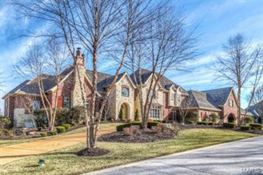 Amazing custom built home on 2.16 acres on the bluffs overlooking St. Albans! 1.5 story home w/5 bedrms, 5 full & 3 half baths. 7500 sq.ft. of living space! The brick & stone exterior w/ arched carriage style entry to the 4 car garage. GR has 18' ceilings, 5" reclaimed wood floors, massive stone fireplace & custom millwork. Gourmet kitchen has handcrafted Knotty Alder custom cabinetry, custom granite countertops, Wolf gas stove,subzero refrigerator & a beautiful center island w/custom tiered ceiling. Hearth room off the breakfast rm & a built in coffee bar. Master suite is spacious & has his & her organized walk-in closets. Master bath has a bubble bain soaking tub & a 13 X 4 walk thru shower w/multi-shower heads. Absolutely incredible! LL is finished w/ large family room, studio apartment w/kitchen, full bath & laundry room. Outside is an inground pool, screened-in deck & beautiful patio area leading to a professionally landscaped yard w/ a Koi pond & waterfall. Views are spectacular!