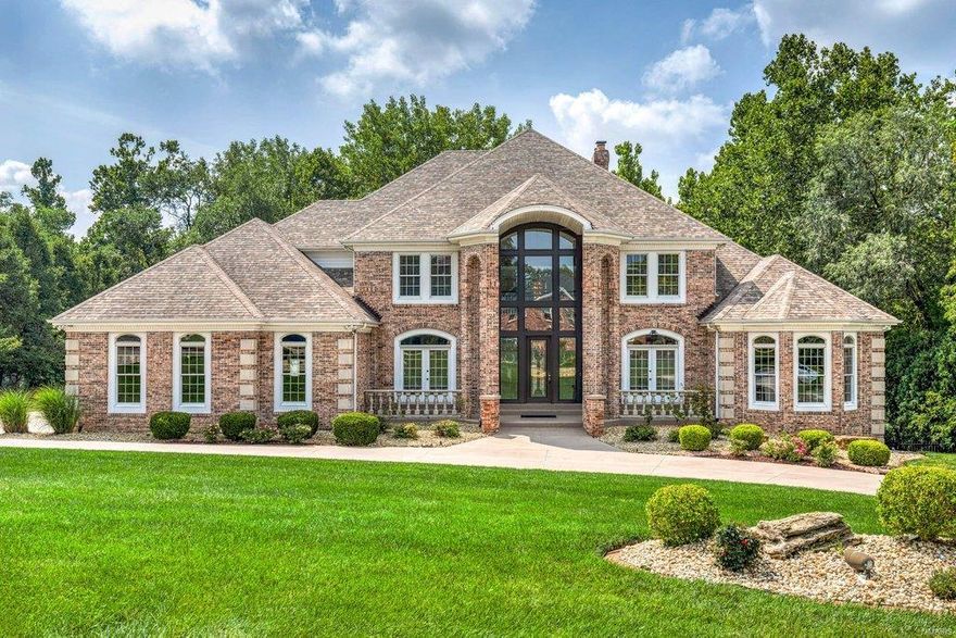 Exceptional craftsmanship & distinctive design elements define this extraordinary 8200 sq ft Estate home. 2-Sty marble foyer highlighted by dramatic floating staircase leads to elegant dining room & stunning great room with marble fireplace flanked by built-in bookcases & expansive wall of windows. Spacious open kitchen featuring 42” white cabinetry, premium appliances & butterfly center island adjoins light-filled breakfast room & hearth room with brick fireplace. Coffered primary bedroom suite radiates warmth with a marble fireplace, wide bay window, luxury bath with jetted tub & adjacent study with custom built-ins. Front & rear staircases access 3 additional ensuite bedrooms. Lower Level includes recreation room with wet bar & 3rd fireplace, media room, game room & bonus room plus office & guest suite. Situated on a 1.7-acre lot with wrap around deck with gazebo, patio with wet bar, hot tub & pool with waterfall. A geothermal system functions to significantly reduce utility bills.