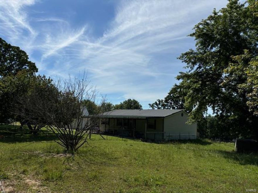 Are you dreaming of a place in the country where you can raise goats, chickens, mules, and other livestock, but is still close to the convenience of town? If so.....welcome home! This charming modern farmhouse has 3 bedrooms, 2 bath and is located on 1.58 mostly fenced acres with peaceful country tranquility. The level yard is the perfect place for summer barbecues with your family and friends! The remaining acreage is divided into 2 separate designated fenced pasture areas for your livestock! There is even a detached metal garage for your vehicle, storage, or workshop! The high ceilings and open floor plan will catch your eyes as soon as you walk in the front door. The tastefully decorated kitchen and living areas are very inviting and spacious with plenty of room for hosting holiday gatherings. You don't want to miss this opportunity for country living at its finest! Call today for your personalized showing!