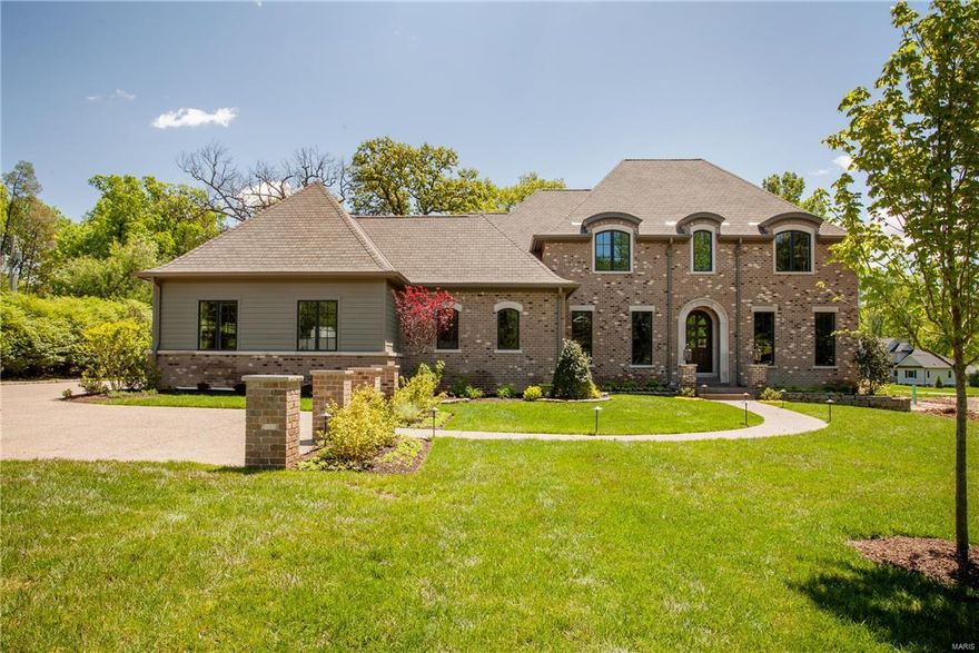 Exceptional, newly built custom 5000 sq ft plus home in Ladue schools on a flat acre parcel featuring a floor plan designed for effortless living, both indoors and out. Incredible details throughout including stunning job finished hardwood, box beam ceilings, custom millwork and designer lighting. The gourmet kitchen features gorgeous finishes opening to a dramatic hearth room with full masonry fireplace. The master en suite includes walk in closets with built ins and a stunning spa like bathroom…finishes that extend to the three upper level en suites as well. Utility rooms on both floors, separate office area, and two first floor half baths are functional delights while the finished lower level includes an additional en suite and tons of light filled entertaining space. Don’t miss the backyard outfitted with a slate patio and loggia with outdoor fireplace… truly your personal resort like oasis. Additional Rooms: Mud Room COOL: 14 SEER+